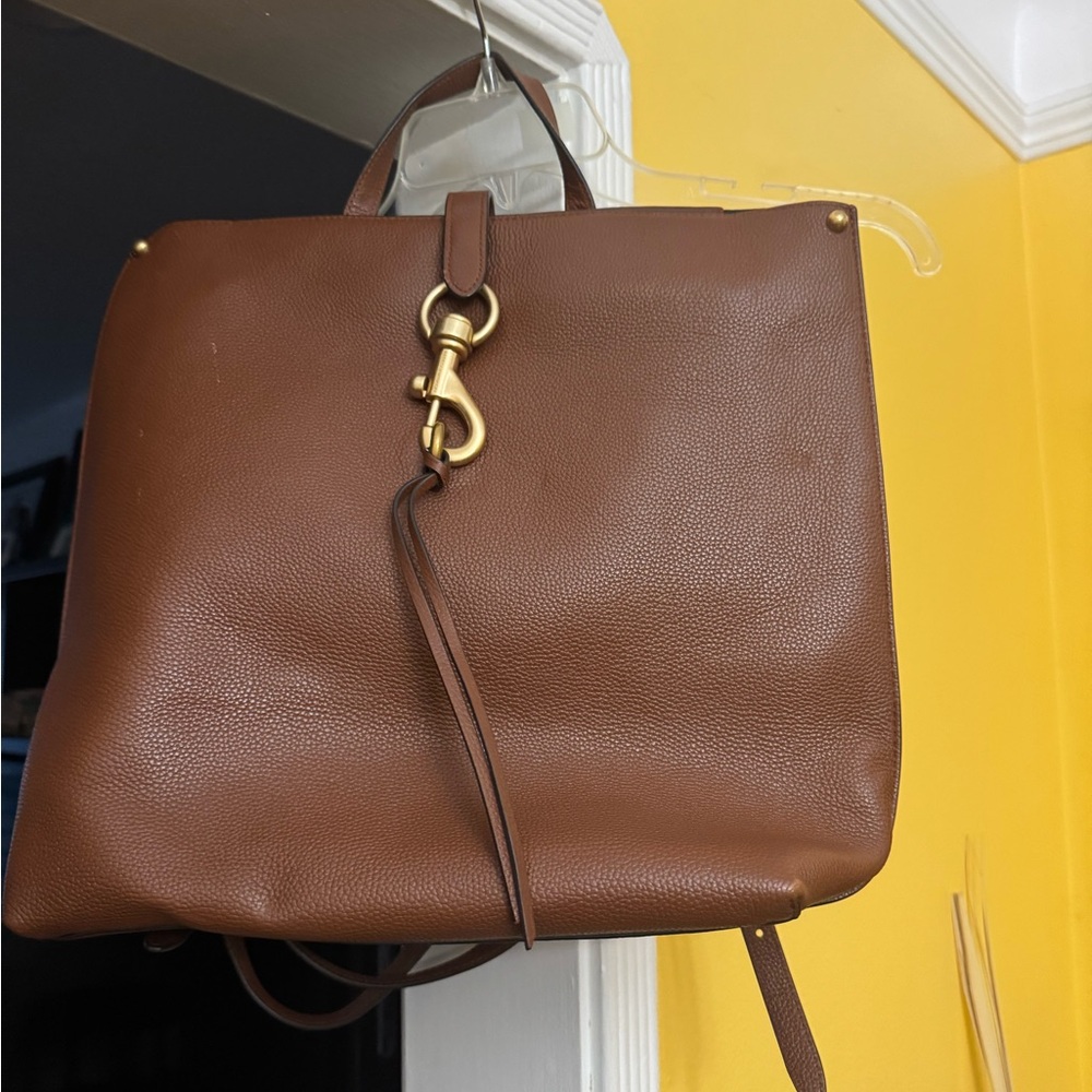 Rebecca Minkoff Brown Leather and Gold Backpack with Structured Design.